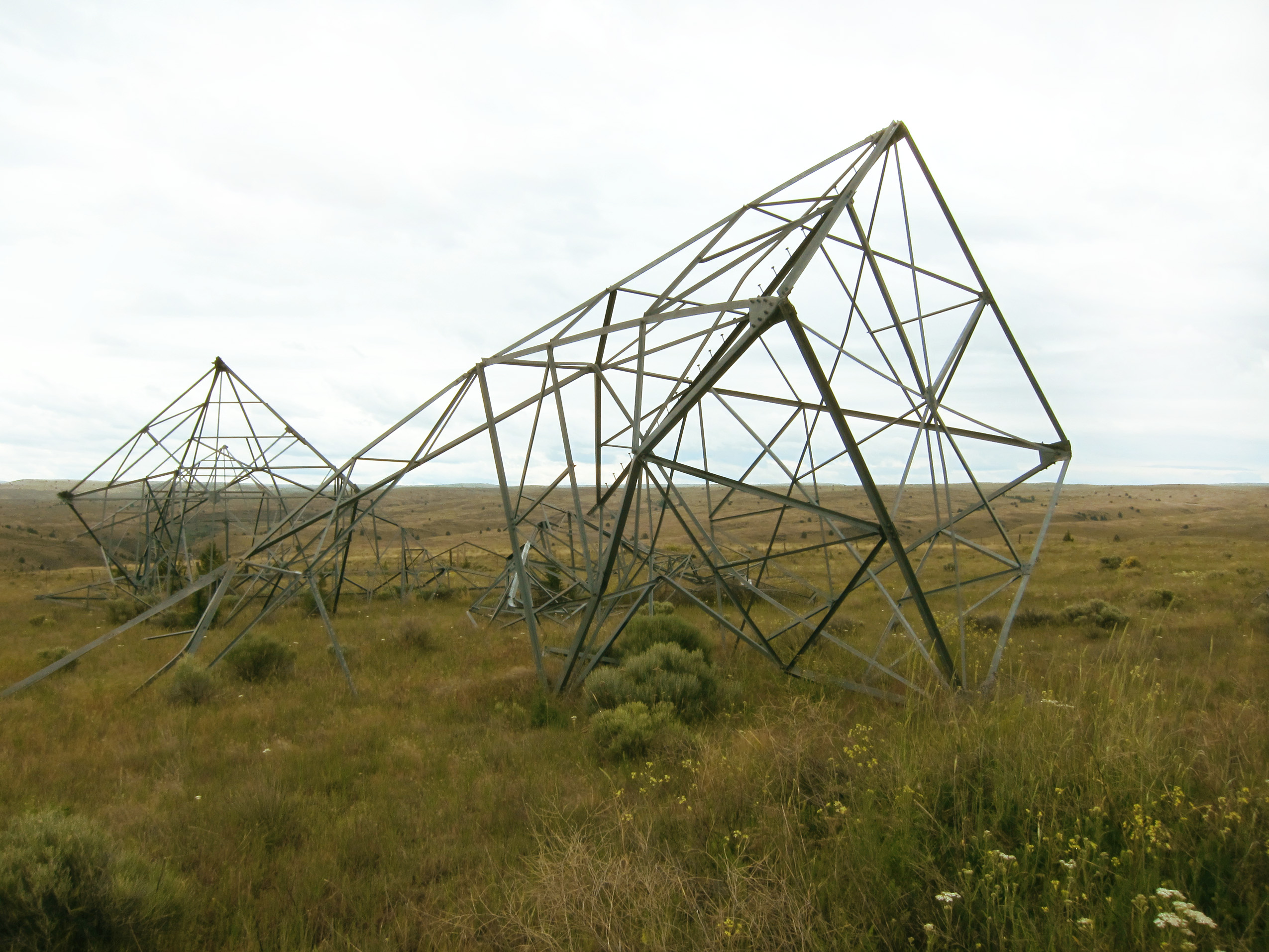 Collapsed metal structure in field.